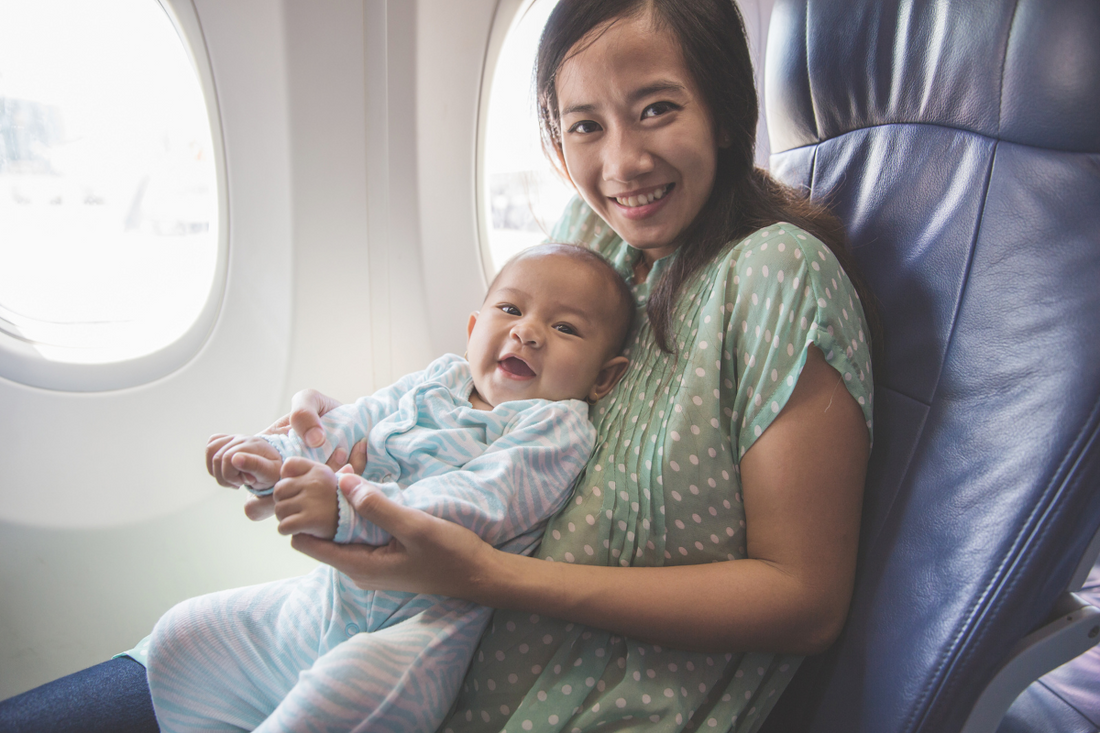 Woman with child in an airplane